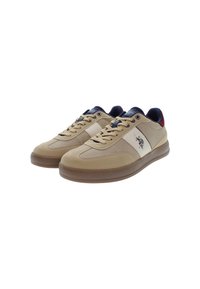 Béžové tenisky s hladkou kůží a textilními detaily. Obsahují bílou boční část, námořnické akcenty a hnědou gumovou podrážku. Další logo na boku.