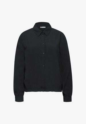 Chemise noire à manches longues avec col, taille élastique et poignets à boutons, présentée sur un fond blanc.