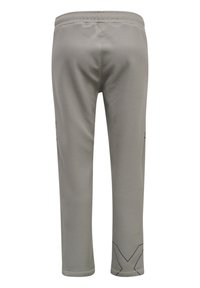 Lichtgrijze sportbroek met een elastische tailleband. Bevat zwarte geometrische accenten bij de zoom en is gemaakt van een soepele, rekbare stof.