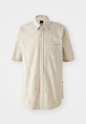 Beige short-sleeve shirt made of cotton, featuring a button-down collar, front pocket, and white buttons, with an orange label on the collar.