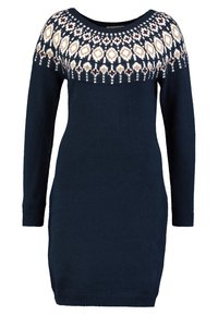 Robe en tricot bleu marine à manches longues et col rond, ornée d'une encolure géométrique aux motifs blancs, beiges et bruns.