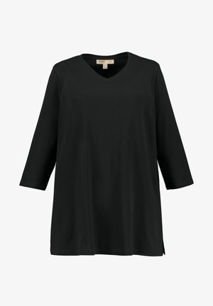 Top nero a scollo a V con maniche tre quarti, realizzato in tessuto morbido, caratterizzato da una vestibilità comoda e fessure laterali per facilitare i movimenti.