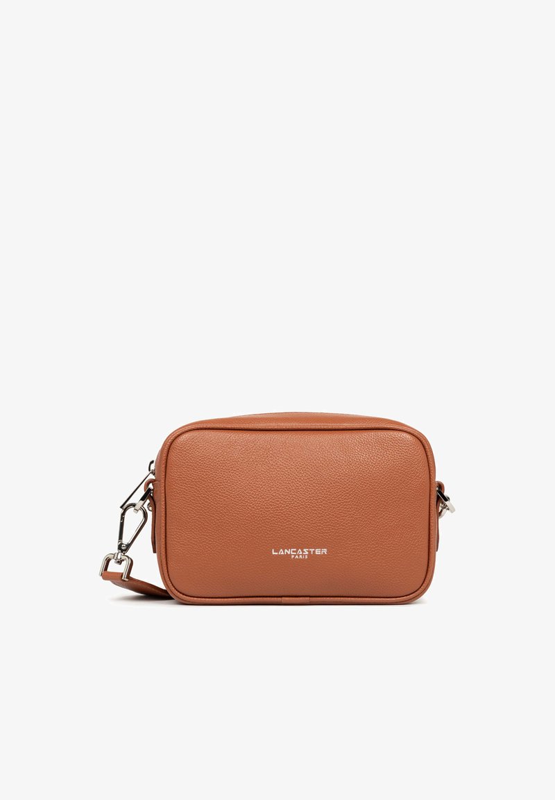 Rectangular crossbody bag in textured brown leather. Features a silver-tone hardware strap and embossed "LANCASTER PARIS" logo on the front.