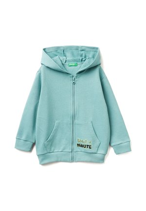 Felpa con cerniera di un leggero teal realizzata in tessuto morbido, con tasca frontale; presenta il testo "Watta Minute" in un colore a contrasto.