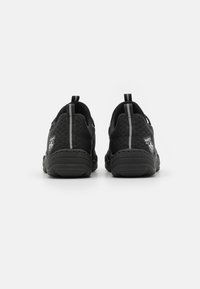 Black athletic shoes with mesh material, rounded back design, and contrasting gray accents. Features pull tabs for easy wear.