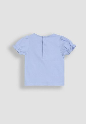 Light blue cotton shirt with short puff sleeves and a round neckline. Features two snap buttons at the back and finished hemline.