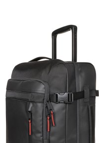 Black rolling bag with a textured finish. Features dual red zippers, a sturdy retractable handle, and a side buckle strap.
