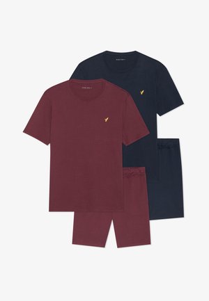 Zestaw dwóch koszulek w kolorach burgundowym i granatowym, z okrągłymi dekoltami i krótkimi rękawami, z małym złotym logo ptaka na piersi.