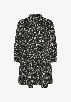 Czarna sukienka w kwiaty z długimi rękawami, kołnierzykiem, zebranymi warstwami i zapięciem na guziki. Posiada biały wzór kwiatowy na ciemnym tle.