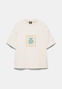 Off-white short-sleeve T-shirt with green text saying "Seriously dude, catch only the waves you feel you need to" surrounded by yellow starfish.