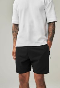Next REGULAR FIT - Tepláky - black