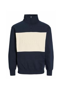 Sudadera azul marino con cremallera hasta el pecho, con una amplia franja horizontal beige y el texto en relieve "ORIGINALS" en el pecho.
