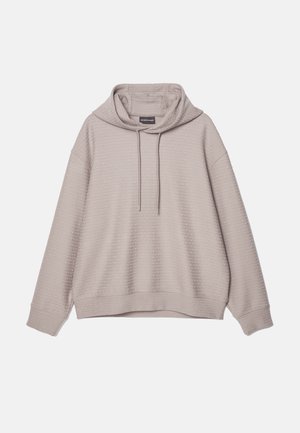 Beige pitkähiha, hupullinen collegepaita, jossa tekstuurillinen kangas, etukappaleen kiristysnarut, resorit hihansuissa ja helmassa, esitetty yksiväristä valkoista taustaa vasten.