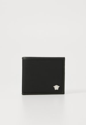Black bifold wallet made of smooth leather, featuring a silver logo accent on the lower right corner and visible stitching along the edges.