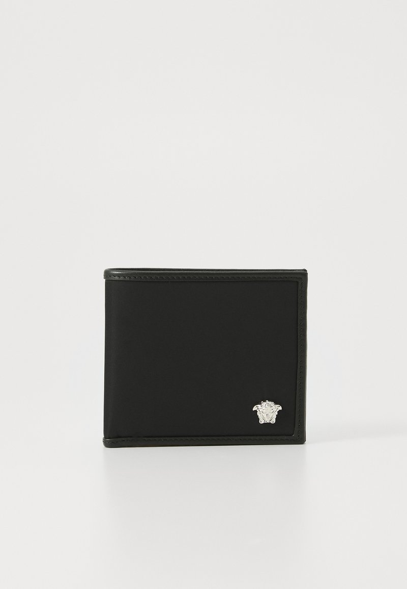 Black bifold wallet made of smooth leather, featuring a silver logo accent on the lower right corner and visible stitching along the edges.