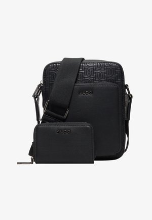 Sac bandoulière noir ALDO avec un motif logo texturé et un portefeuille zippé assorti, tous deux avec une bandoulière large réglable et un tire-zip argenté.