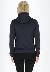Navy hoodie with a high collar, long sleeves, and a soft texture. Features a kangaroo pocket and ribbed cuffs and hem.