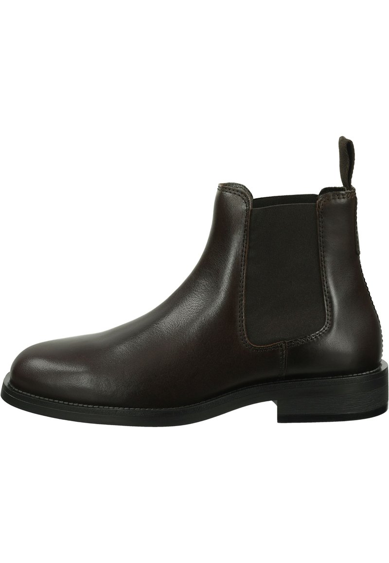 Bottines Chelsea en cuir marron avec des panneaux latéraux élastiques, bout arrondi, tirette au talon et un petit talon bloc. Texture lisse et design épuré.