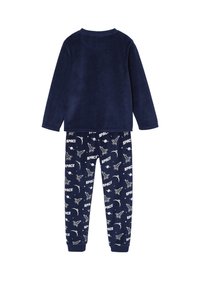 Navy fleece pajama set featuring a solid long-sleeve top and patterned pants with space-themed graphics and text. Soft, stretchy fabric.