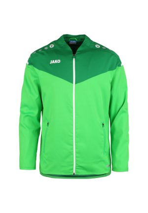 Groene sportjack met een gladde textuur, contrasterende donkerdere groene schouderstukken en rits, logo op de borst, en twee ritszakken aan de zijkant.