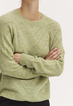Grüner gestrickter Pullover mit einem strukturierten Zickzackmuster. Mit einem gerippten Rundhalsausschnitt und langen Ärmeln. Weicher, leicht lockerer Schnitt.