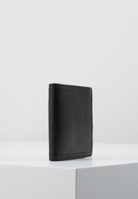 Black leather wallet with a sleek, rectangular design. Features visible stitching along edges and smooth texture.