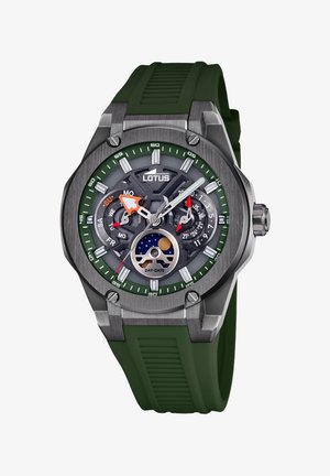 Lotus sat s zelenim silikonskim remenom, sivim metalnim kućištem i višefunkcionalnom brojčaniku koji prikazuje dan i datum te indikator mjesečevih faza.