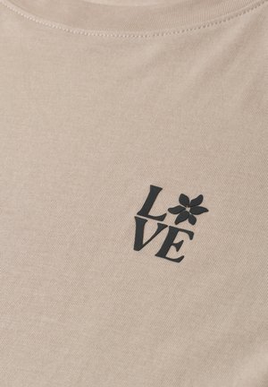 Beiger Stoff mit schwarzem Text "LOVE", wobei der Buchstabe "O" durch eine fünfblättrige Blumen-Grafik ersetzt ist.