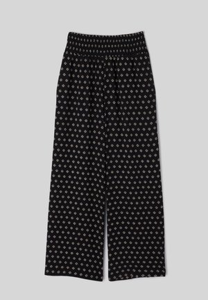 Pantalon noir à jambes larges avec une ceinture smockée élastique et un petit motif losange clair sur toute la surface.