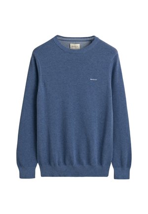 Pull bleu en tissu tricoté texturé, avec un col rond et des poignets et un ourlet côtelés. Petit logo sur la poitrine.