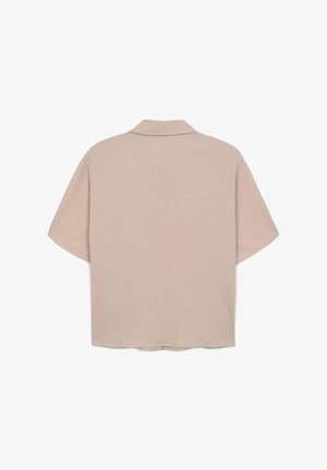 Camicia oversize a manica corta in tessuto beige chiaro con una trama sottile, caratterizzata da un colletto classico e un orlo dritto.