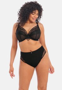 Zwarte kanten bh met beugel en bijpassende hoge taille slipjes, voorzien van doorschijnende panelen en decoratieve accenten. Gladde textuur overal.