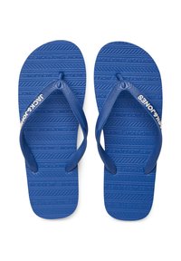 Blauwe rubberen teenslippers met gestructureerde zolen met "JACK & JONES" erop geperst. De bandjes zijn ook blauw en hebben een wit logo-accent.