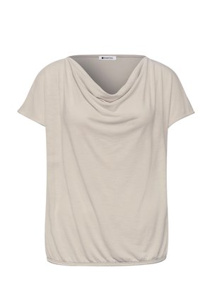 Blouse beige à manches courtes avec col bénitier et ourlet élastiqué, confectionnée en tissu léger et fluide.