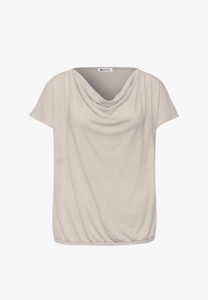 Beżowa bluzka z krótkim rękawem, dekoltem typu kapturek i elastycznym dołem, wykonana z lekkiego, płynącego materiału.