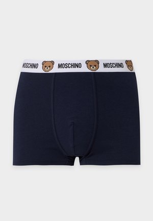 Cuecas boxer azul-marinho com cintura elástica branca, apresentando repetidamente rostos de urso castanho e texto "MOSCHINO".
