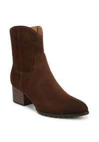 Bottine en daim marron avec un bout pointu et un petit talon empilé. Présente un dessus lisse et des découpes discrètes sur les côtés. Semelle en caoutchouc pour une meilleure adhérence.