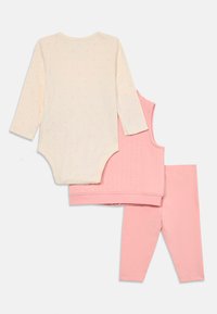 Three-piece baby outfit: cream long-sleeve bodysuit with pink polka dots, pink quilted vest, and matching pink leggings. Soft cotton material.