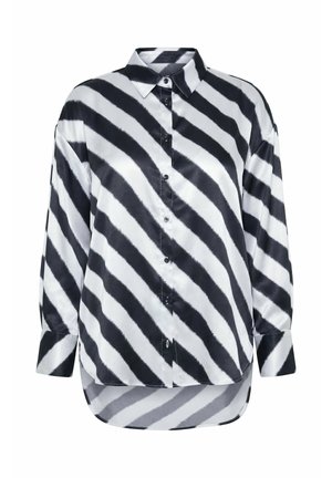Camicia in satin a maniche lunghe con strisce diagonali in bianco e nero, bottoni, colletto appuntito e orlo arrotondato più lungo sul retro.