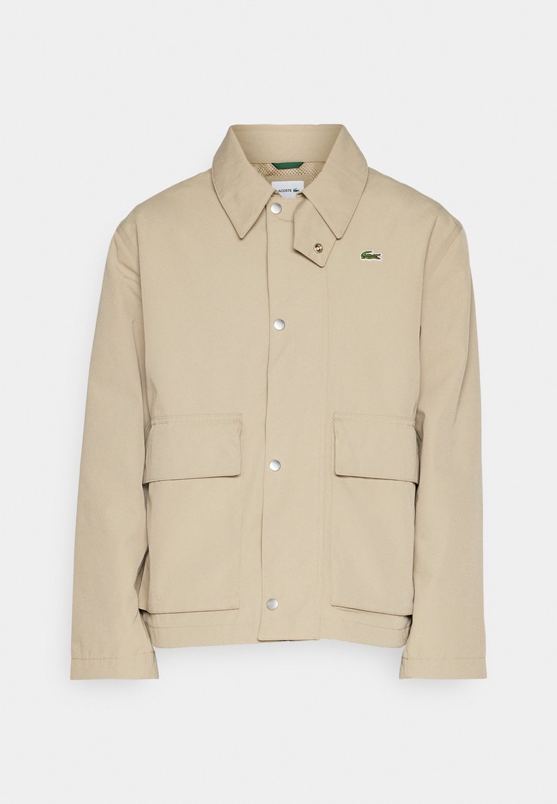 Lacoste Lichte jas zandkleur