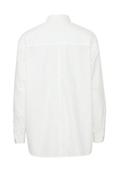 Balta, ilgomis rankovėmis medvilninė marškiniai, su nugaros iškirpte ir užsegamomis rankovėmis, su laisvu, neformalu siluetu.