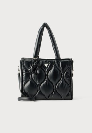 Sac tote noir matelassé avec poignées rembourrées, sangle amovible et grand charm "G" à l’avant.