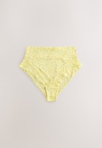 Yellow lace high-waisted women's underwear with floral pattern and scalloped edges laid flat on a neutral background.