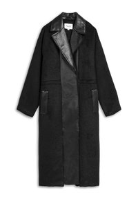 Schwarzer Mantel mit einem strukturierten Wollkörper und Kunstlederkragen sowie -taschen. Hat ein langes, offenes Design und übergroße Ärmel.