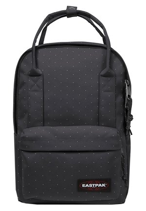 Czarny plecak Eastpak z małymi białymi grochami, przednią kieszenią na zamek, podwójnymi uchwytami u góry i głównym zamkiem błyskawicznym.