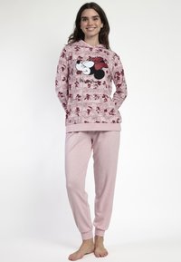 Sudadera rosa con diseño de tira cómica y gráfico de Minnie Mouse, combinada con pantalones jogger rosa a juego con puños elásticos. Tejido suave.