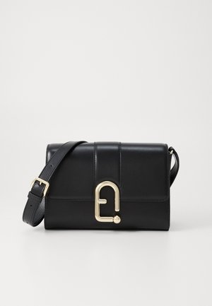 Black leather handbag with a structured design, featuring a gold-tone clasp and an adjustable strap. Smooth texture and minimal stitching details.