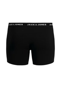 Boxers noirs en tissu lisse avec un design ajusté. La taille affiche le nom de la marque "JACK & JONES" en lettres blanches.