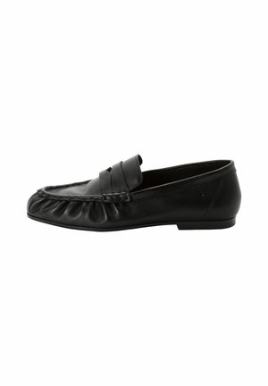 Black leather penny loafer with rounded toe, low heel, and gathered stitching detail along the front edge.