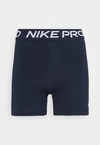 Tummansininen Nike Pro -shortsit, joissa on valkoinen logo ja vyötärö. Valmistettu venyvästä kankaasta, jossa on litteät saumat ja tiukka malli.